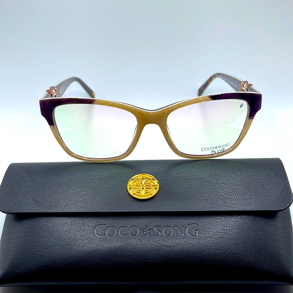 NWOT. Coco Song feather and silk collection. Purple, turquoise, and sand frames.
